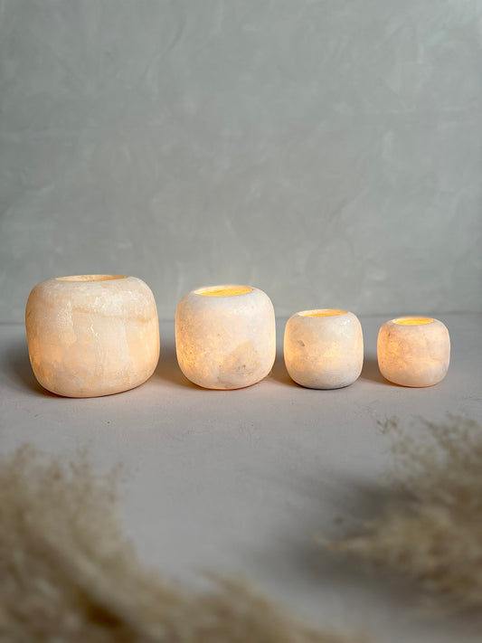 Roya the Brand alabaster round candle holders arranged in line