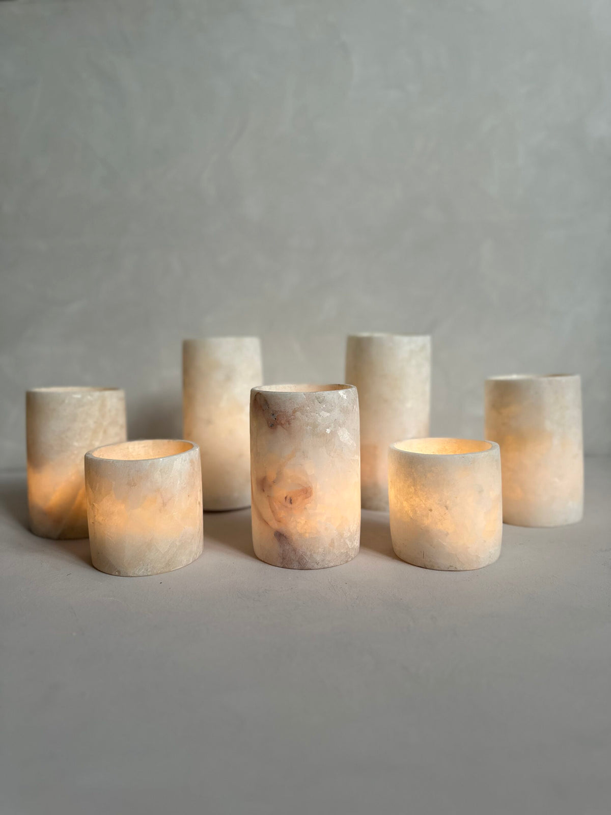 Soft light from Roya the Brand alabaster cylinder candle holders