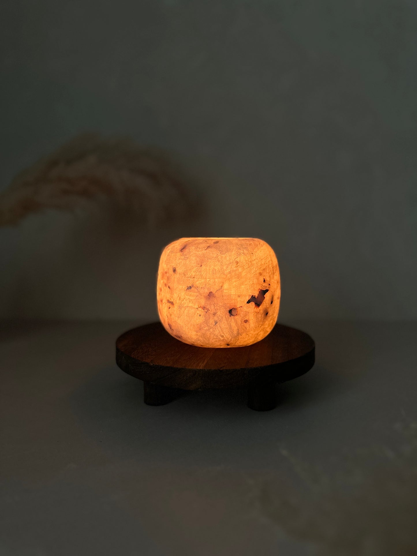 Alabaster light fixture on a dark background